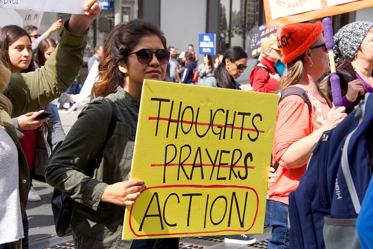 Gun Control Supporter Holding Sign